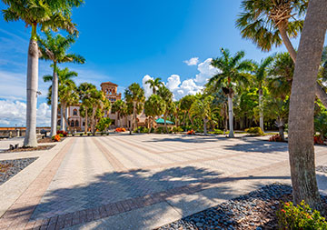 Photo of a courtyard. Links to Meet Our Staff