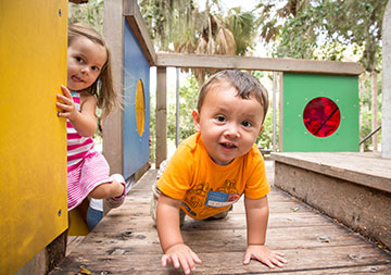 Photo of children playing. Links to Gifts of Life Insurance